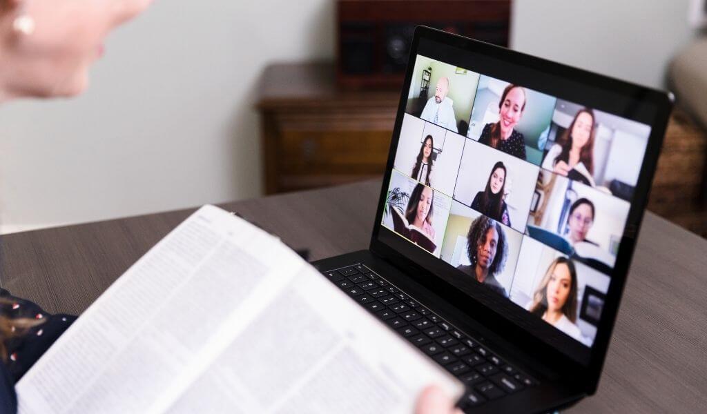 Laptop screen with multiple people